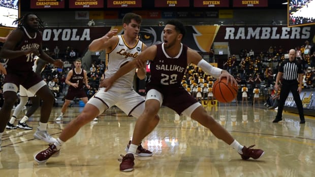 Jan 25, 2022; Chicago, Illinois, USA; Southern Illinois Salukis guard Steven Verplancken Jr. (22) dribbles against Loyola (Il) Ramblers guard Braden Norris (4) during the first half at Joseph J. Gentile Arena. Mandatory Credit: Matt Marton-USA TODAY Sports